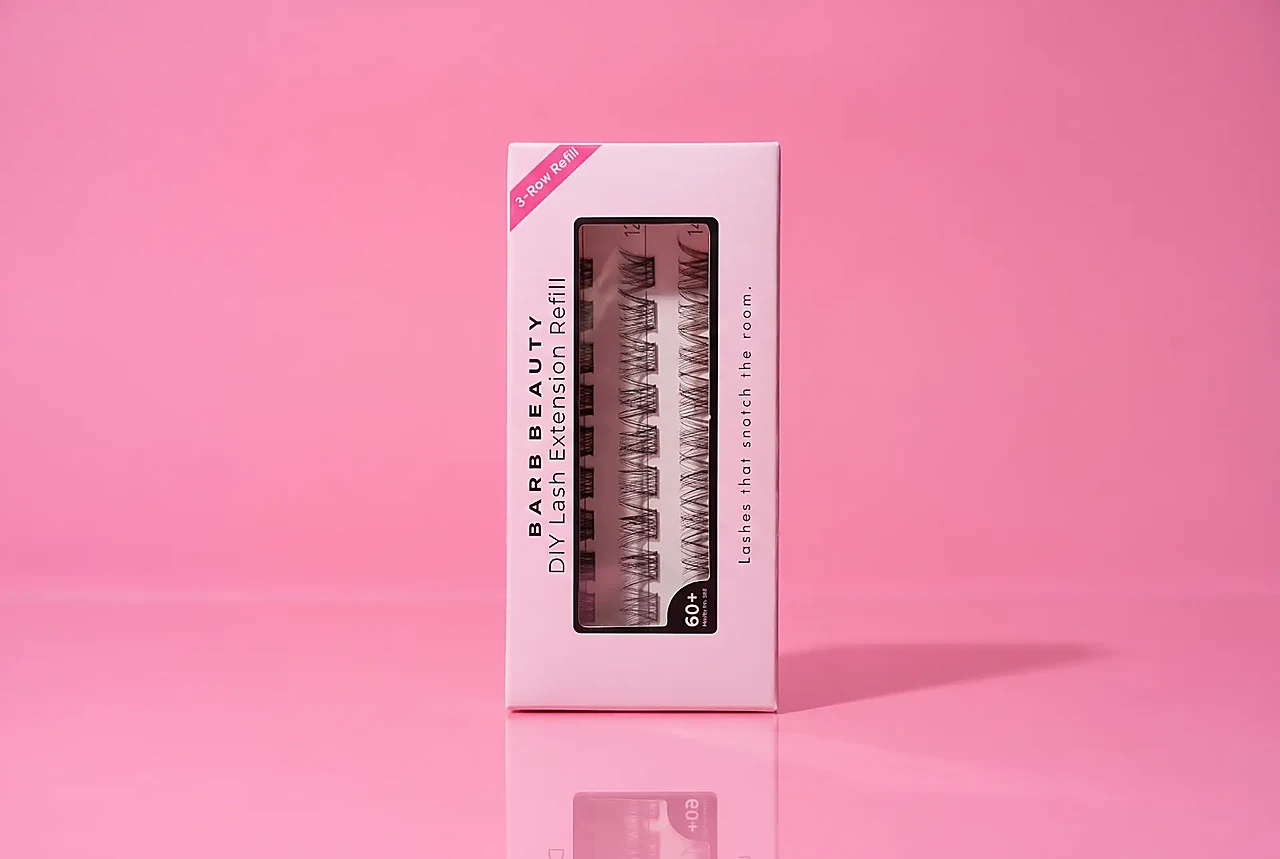 Lash Barb Beauty Whisper 3-Row Refill box on a soft blush pink backdrop