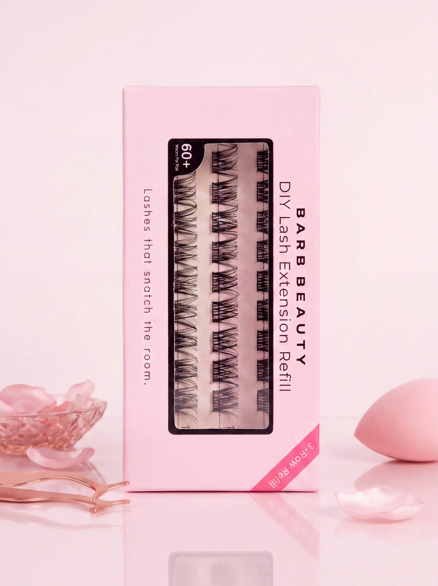 Lash Barb Beauty 3-Row Refill box with fluffy cluster lashes, tweezers, and makeup sponge on a soft pink background